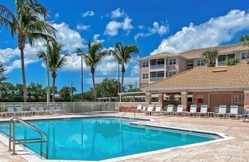 Majestic Palms Condo | Condo 3miles from beach Pool Highly desired elevator gated Disc for Displaced Sr