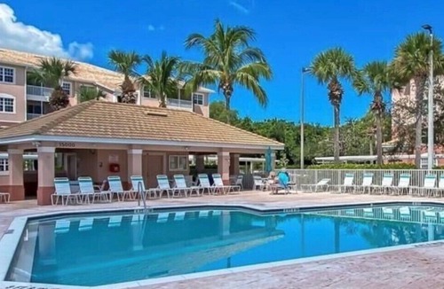 Majestic Palms Condo | Condo 3miles from beach Pool Highly desired elevator gated Disc for Displaced Sr