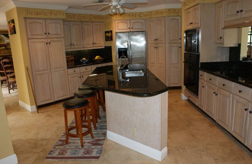 Hunt Club Bed & Breakfast | Country Garden Room with Water Garden feature and Queen Bed.