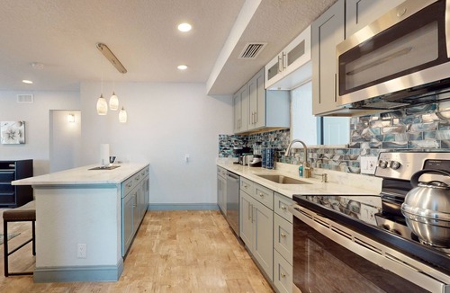 Riviera Beach House | Cozy home with B.B.Q.grill, hot tub, central AC, and enclosed yard