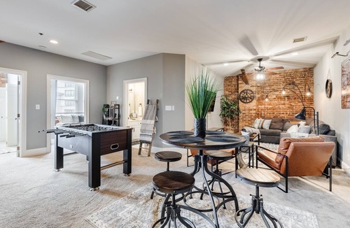 Greenville Downtown Apartment | Cozy Industrial 2-KING Bdrm S. Main Street Downtown Condo w/Foosball Table