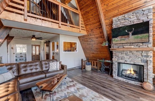Tate Cabin | Cozy Mountain A-frame with pools, horseback riding, lake, tennis and more!