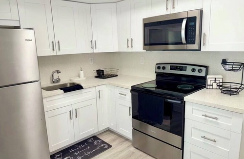 Kendall House | Cozy two bedroom Miami home with private parking at your front door.