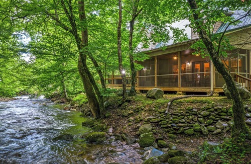 Cosby Cabin | Creekfront cabin with cozy interiors, hot tub & game room.