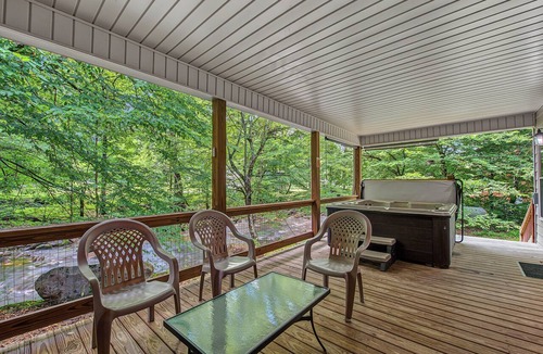 Cosby Cabin | Creekfront cabin with cozy interiors, hot tub & game room.