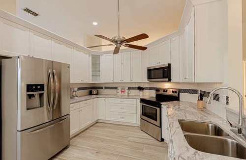 Crown Pointe House | Crown Pointe Heated Pool Home, Covered Lanai w/TV- Renovated w/Coastal Flair, King in Master