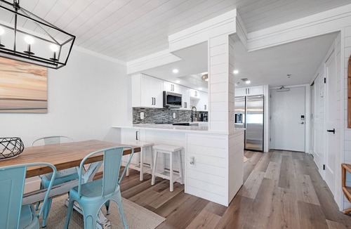 New Smyrna Beach Condo | Direct oceanfront condo with a large balcony, heated pool, and beach access