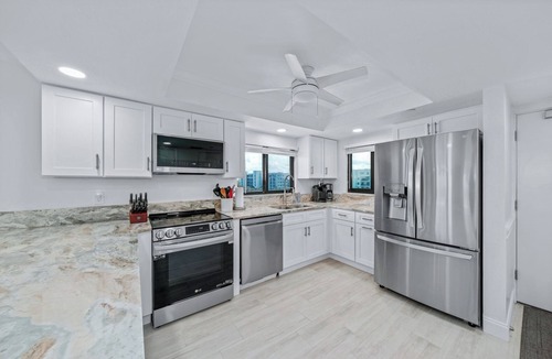 New Smyrna Beach Condo | Direct oceanfront southern corner condo with large wrap-around balcony and heated pool