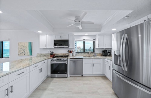 New Smyrna Beach Condo | Direct oceanfront southern corner condo with large wrap-around balcony and heated pool