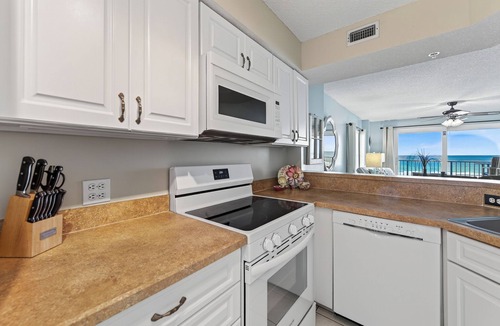 Seawinds Condo Condo | Direct oceanfront corner condo with large balcony, beachfront pool, and garage parking