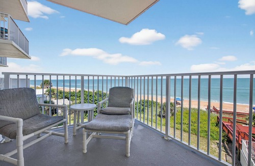 Seawinds Condo Condo | Direct oceanfront condo with a private balcony, heated beachfront pool, and garage