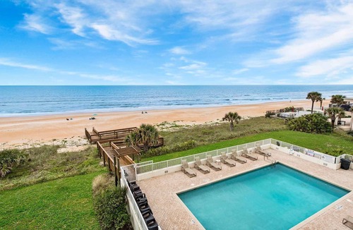 Seawinds Condo Condo | Direct oceanfront condo with a private balcony, heated beachfront pool, and garage