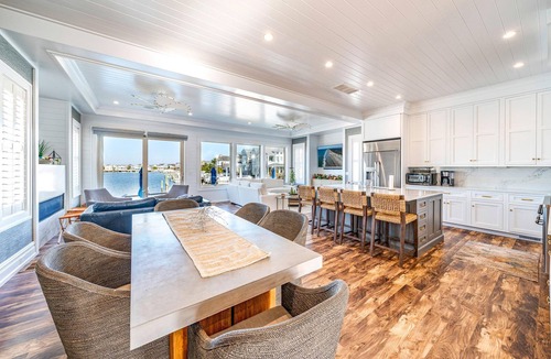 Stone Harbor House | Discover an extraordinary waterfront haven with this magnificent bayfront residence that boasts a.