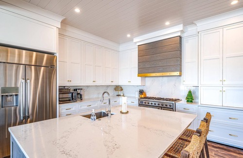 Stone Harbor House | Discover an extraordinary waterfront haven with this magnificent bayfront residence that boasts a.