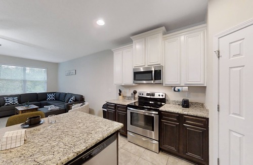 Westside House | Dog-friendly home with a screened porch, washer/dyer, games & modern charm