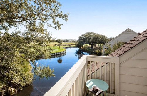 Spinnaker Beachhouses Villa | Dog-friendly villa near beach with pool access, patio, central AC & washer/dryer