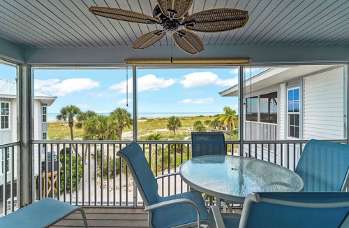 Palm Island Villa | Enjoy a Beautiful Gulf Sunset from the Screened Porch on Resort Villa A3221B