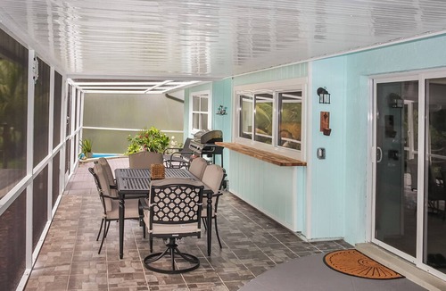 Fort Myers House | Enjoy a stunning waterfront view, pool table,kayaks, fishing, BBQ, heated & pool