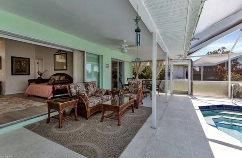 Deep Creek House | Enjoy lake views from the lanai. Charming 3-bdr home in quiet Deep Creek sub.