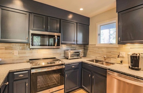 West Beach Condo | Enjoy Stunning River Views, Community Pool & Beautiful Furnishings, Dog Friendly. Walk to Beach!