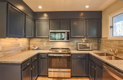West Beach Condo | Enjoy Stunning River Views, Community Pool & Beautiful Furnishings, Dog Friendly. Walk to Beach!