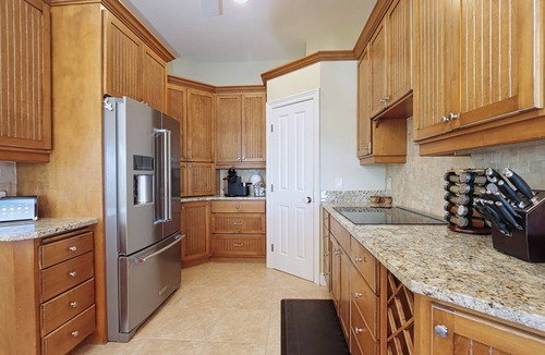 Beachview Country Club Estates House | Exquisite river-view home with heated pool and spa in the expansive lanai