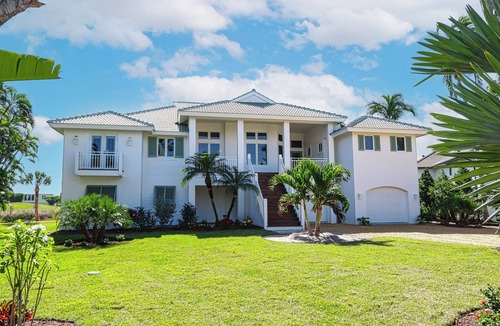Beachview Country Club Estates House | Exquisite river-view home with heated pool and spa in the expansive lanai