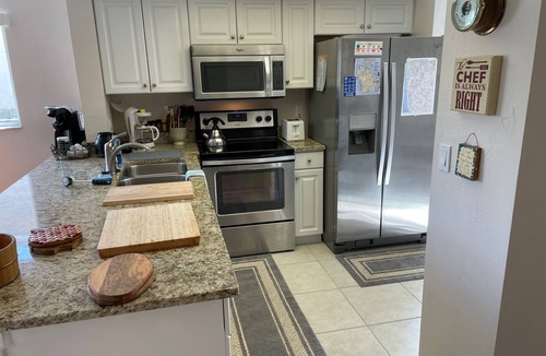 Lely Golf Estates Condo | Fantastic 3BR overlooking Hibiscus Golf Course! Heated Pool! EZ drive to Beach!