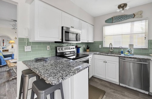 Anna Maria House | Flirty Flamingo Cottage Updated beach cottage, moments from the sand, w/pool!