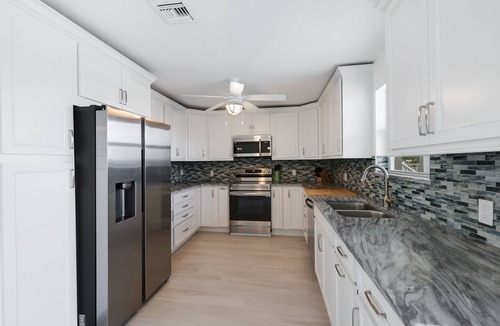 Biggar Villa | Florida Style Villa by the Water with heated Pool, Dock, Gulf access! Kayaks!