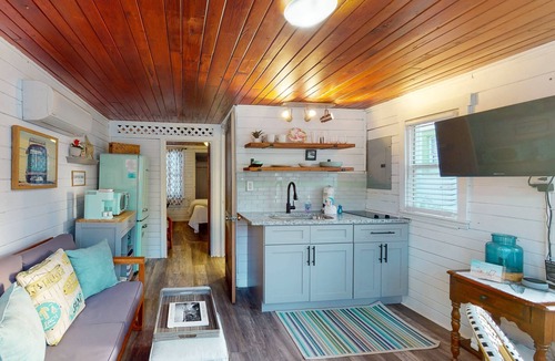 Treasure Island Condo | Fresh vintage beach vibes! Happy day getaway w/beachfront access, community fire pit & lounge area.