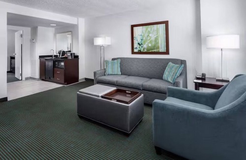 Florida Central Atlantic Coast Hotel | Fun-Filled Resort Getaway l 4 Spacious Suites + Free Breakfast & Park Shuttle