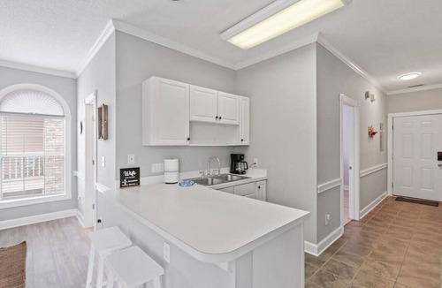 Central Myrtle Beach Apartment | Golfers' Getaway w/pool, patio, grills, kitchen