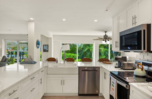 Shell Harbor House | Gorgeous canal front home walking distance to the beach!