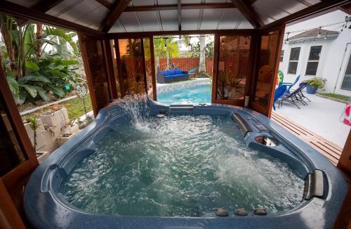 Tropic House | Gorgeous Urban Oasis withHot Tub, HEATED POOL and Private Movie Theater home