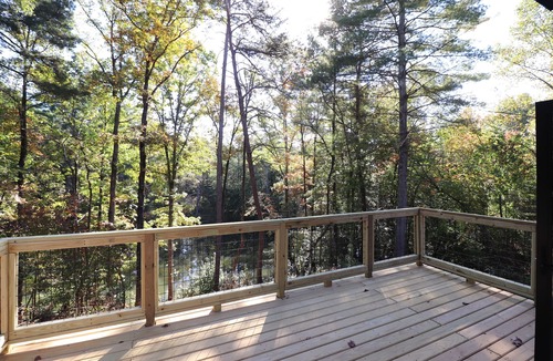 Roaring River Cabin | Gotham City Cabins! Secluded “Custom Modern Cabin” overlooking Private Pond.