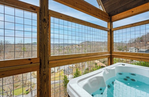 Gatlinburg Cabin | Great location with a view! Enjoy the sauna and the hot tub and check out bears