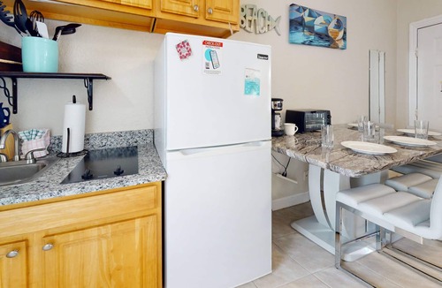 Redington Beach Condo | Great Value! Steps to Beach - Large Patio Area ~ Heated Pool ~ Free Parking - Ground Floor Condo