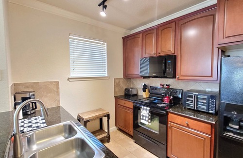 Wellington Condo | Ground floor condo, no carpet, community pools, fitness room, 9 miles to Disney World