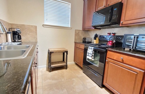 Wellington Condo | Ground floor condo, no carpet, community pools, fitness room, 9 miles to Disney World