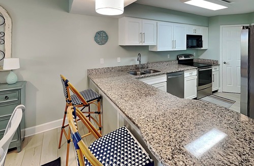 Butler Beach Condo | Ground Floor Condo w. Patio, Community Pools + Beach Access