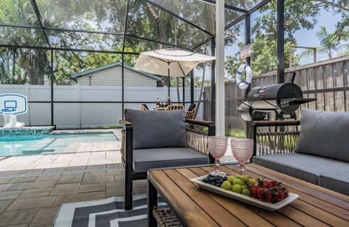 Beach Park House | Heated pool, arcade, 6 TVs, 4-bedroom house with AC, WiFi in brilliant Tampa