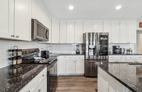 Holiday Beach House | Heated Pool & Pet Friendly | Minutes To Beach | Spacious Backyard | FLPCB38