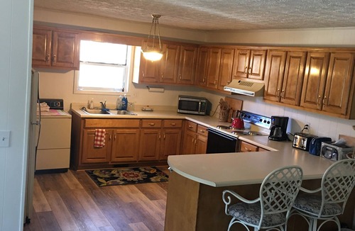 Hiawassee House | Hiawassee Rapids Lodge 4/4 with a hot tub overlooking the river rapids