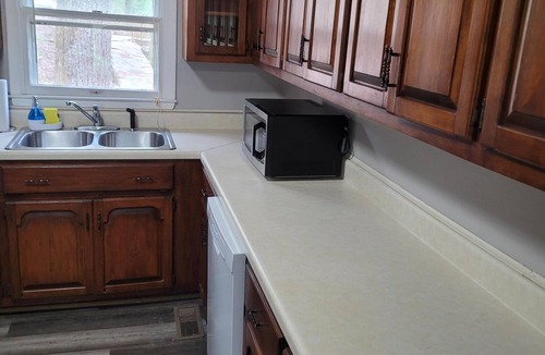 Cullman Cabin | Historic Cabin in a natural setting with waterfalls and covered bridge