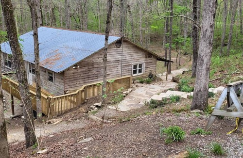 Cullman Cabin | Historic Cabin in a natural setting with waterfalls and covered bridge