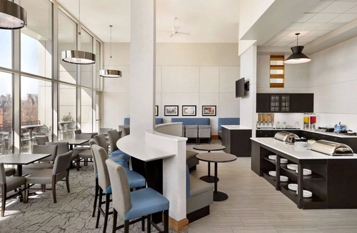 Spruce Hill Hotel | Historic Philly: Stylish Suites with Full Kitchens, Pool Access & Free Parking!