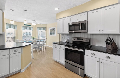 Tybee Island Cottage | Hot Tub + Screened Porches │ Private Dock & Marsh Sunset Views