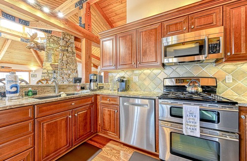 Louisa House | Huge lakefront home with A/C, sunroom, boat ramp, WIFI,game room, deck, & kayaks