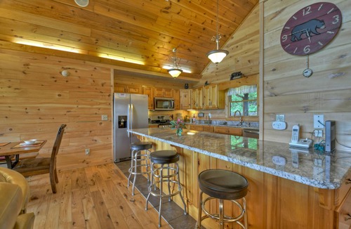 Chatsworth Cabin | Hummingbird Haven is the ultimate retreat for large groups! Enjoy pet-friendly accommodations, breathtaking mountain views, a hot tub, firepit, WiFi, and hiking